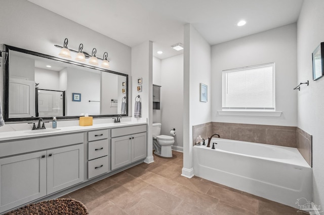 3209 Mountain Laurel Trl, Cantonment, FL 32533 - full bath featuring toilet, double vanity, a bath, a stall shower, and recessed lighting