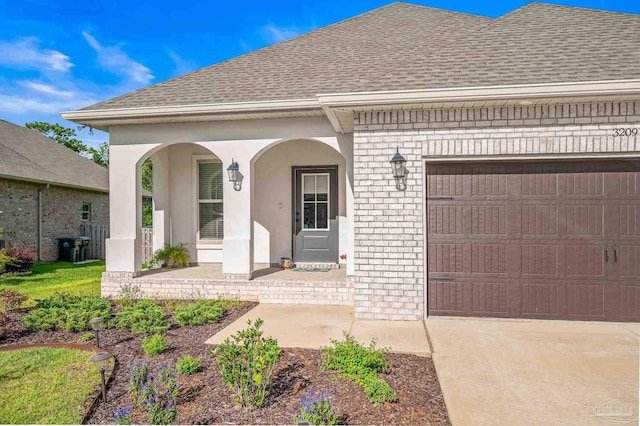 3209 Mountain Laurel Trl, Cantonment, FL 32533 - view of front of property with a shingled roof, covered porch, brick siding, and a garage