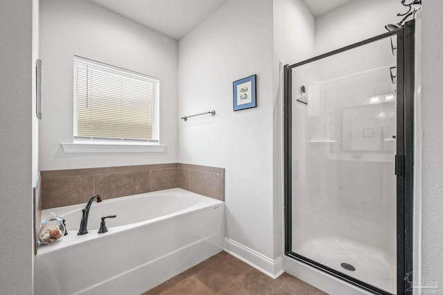 3209 Mountain Laurel Trl, Cantonment, FL 32533 - bathroom with a stall shower, a bath, tile patterned floors, and baseboards