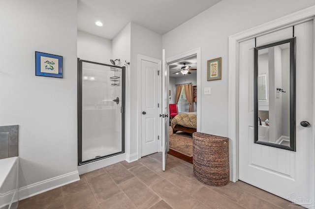 3209 Mountain Laurel Trl, Cantonment, FL 32533 - full bath with connected bathroom, a stall shower, ceiling fan, and baseboards