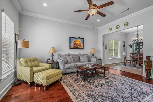 3209 Mountain Laurel Trl, Cantonment, FL 32533 - living area with wood finished floors, a ceiling fan, a chandelier, baseboards, and crown molding