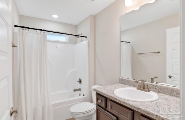 full bathroom with vanity, toilet, and shower / tub combo