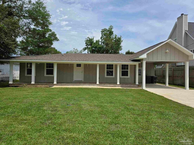 ranch-style house with a porch, a carport, and a front yard