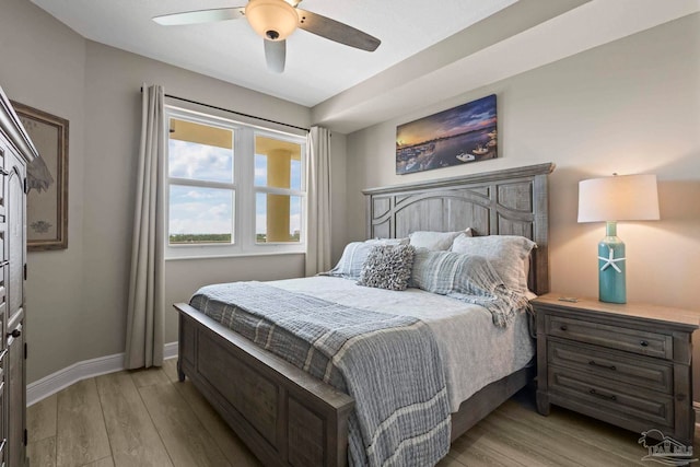 616 Lost Key Dr Unit 902A, Perdido Key, FL 32507 - bedroom featuring light wood-style flooring, baseboards, and a ceiling fan