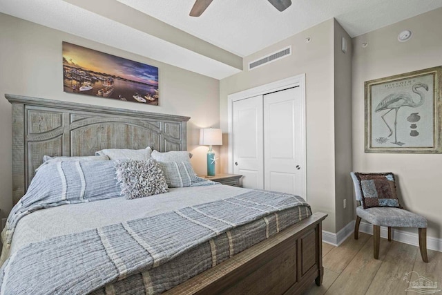 616 Lost Key Dr Unit 902A, Perdido Key, FL 32507 - bedroom featuring light wood-style floors, a closet, baseboards, and ceiling fan