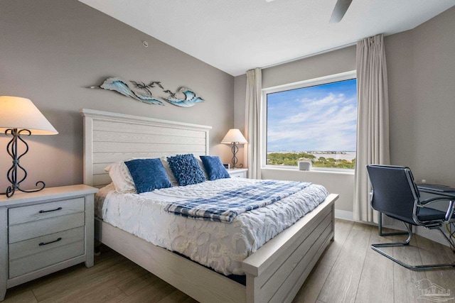 616 Lost Key Dr Unit 902A, Perdido Key, FL 32507 - bedroom featuring light wood finished floors and a ceiling fan