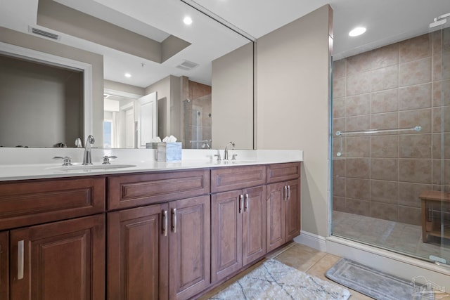 616 Lost Key Dr Unit 902A, Perdido Key, FL 32507 - bathroom featuring a stall shower, double vanity, tile patterned flooring, and recessed lighting
