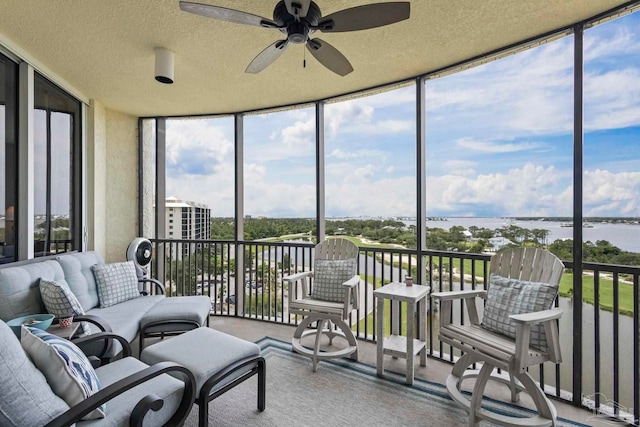 616 Lost Key Dr Unit 902A, Perdido Key, FL 32507 - sunroom / solarium with expansive windows, a ceiling fan, healthy amount of natural light, a water view, and a textured ceiling