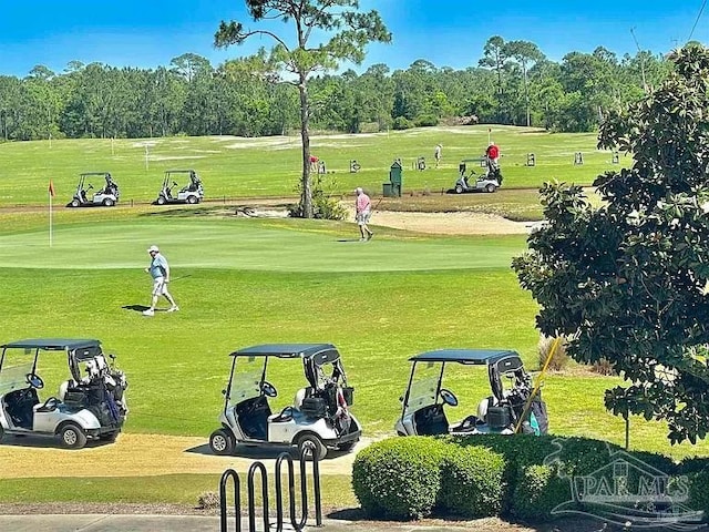 616 Lost Key Dr Unit 902A, Perdido Key, FL 32507 - view of property's community with view of golf course, view of wooded area, and a yard