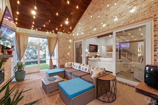 sunroom / solarium with wood ceiling, a fireplace, and vaulted ceiling