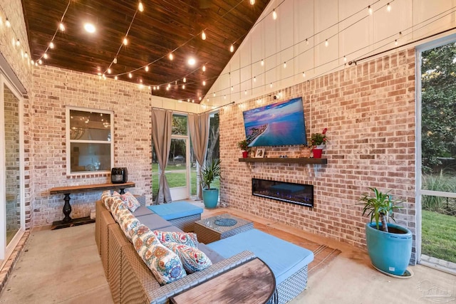 view of patio / terrace with an outdoor living space with a fireplace