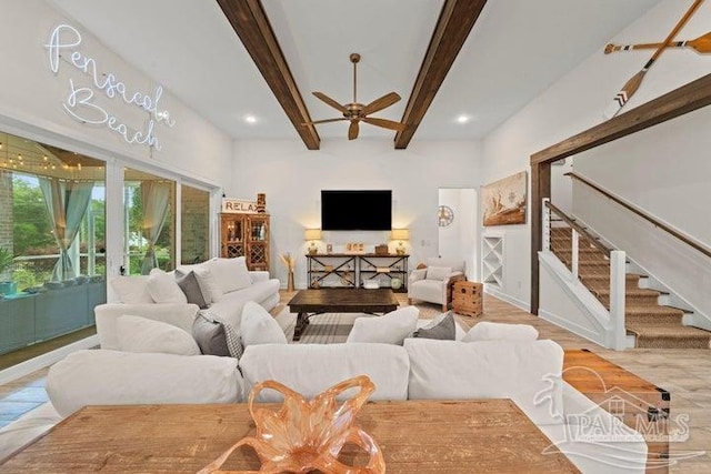 living room with ceiling fan, beam ceiling, french doors, and light hardwood / wood-style flooring