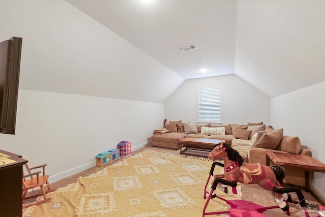 playroom with carpet and lofted ceiling