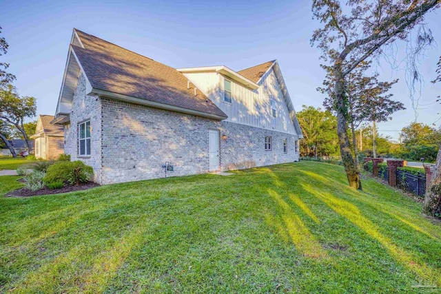 view of home's exterior with a lawn