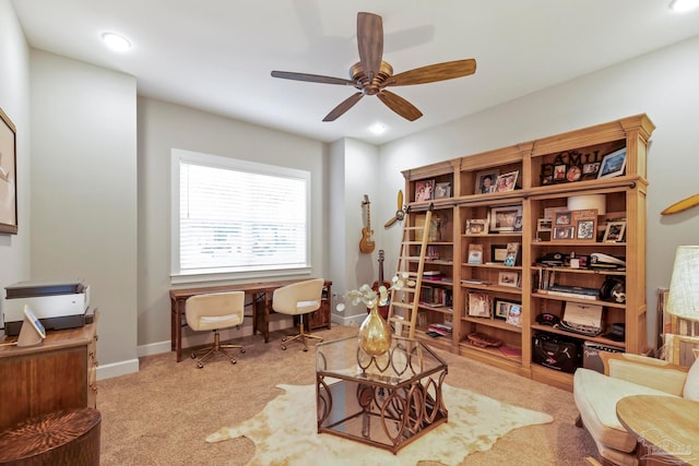 sitting room with ceiling fan and light carpet