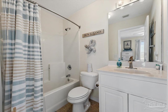 full bathroom featuring shower / bath combination with curtain, vanity, a textured ceiling, and toilet