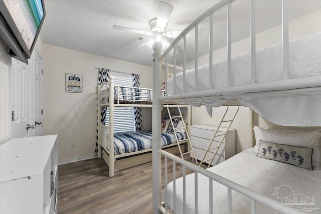 bedroom with hardwood / wood-style flooring and ceiling fan