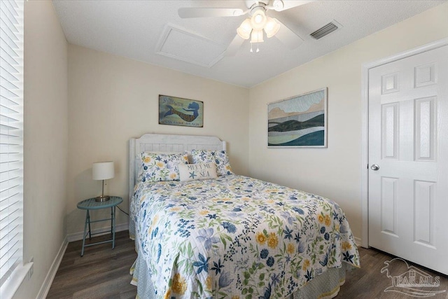 bedroom with dark wood-type flooring and ceiling fan