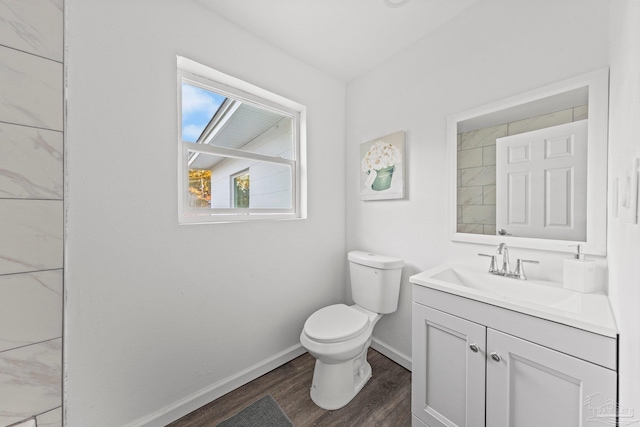 bathroom featuring hardwood / wood-style flooring, vanity, and toilet