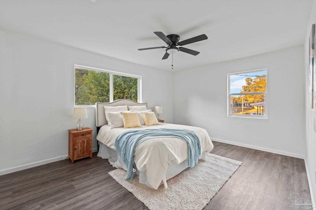 bedroom featuring ceiling fan and dark wood-type flooring