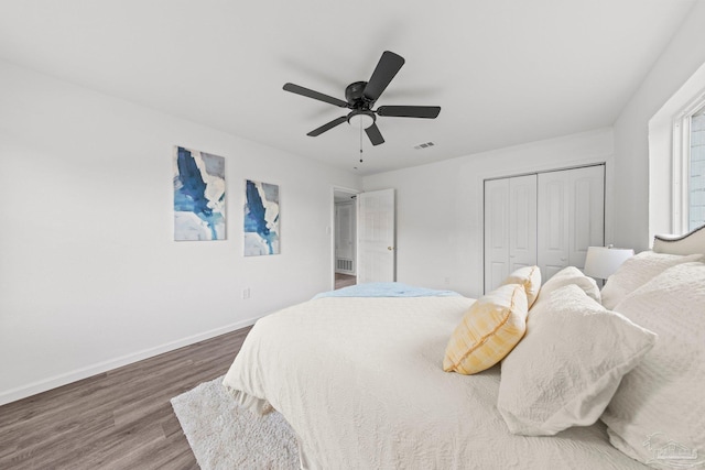 bedroom with ceiling fan, a closet, and hardwood / wood-style floors