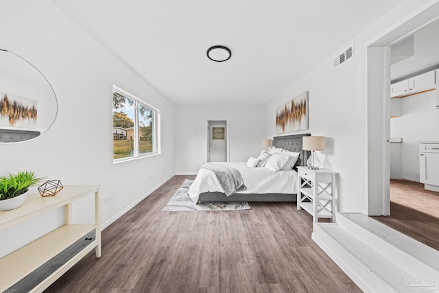 bedroom featuring dark hardwood / wood-style flooring