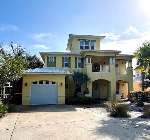 view of front of property with a garage and a balcony