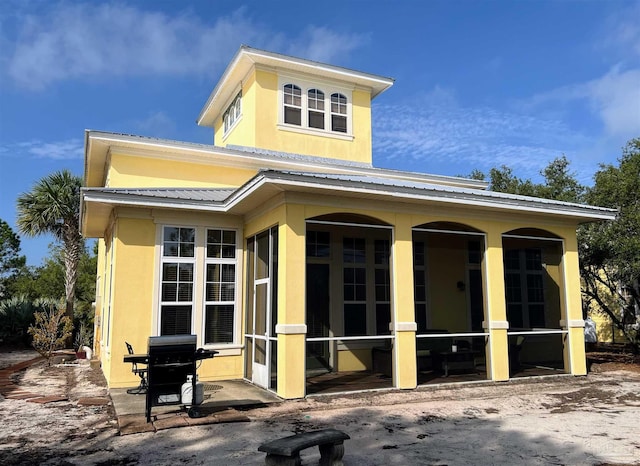 9351 Savane Park, Gulf Shores, AL 36542 - back of house with a sunroom and a patio area