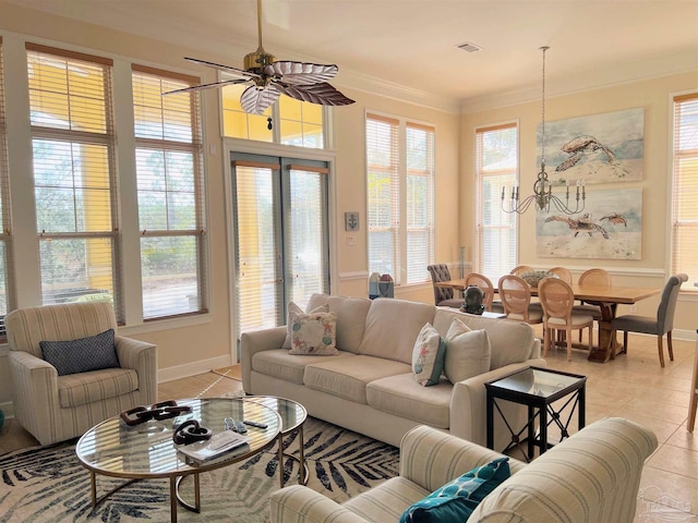 living room featuring crown molding, light tile patterned flooring, and ceiling fan