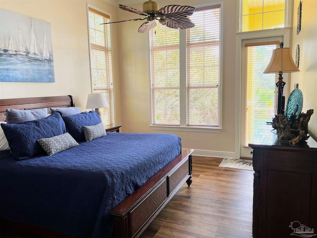 9351 Savane Park, Gulf Shores, AL 36542 - bedroom featuring multiple windows, hardwood / wood-style flooring, and ceiling fan