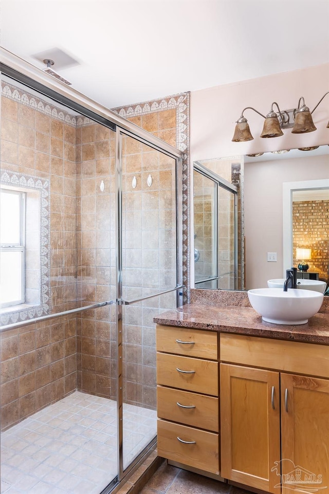 bathroom with vanity and walk in shower