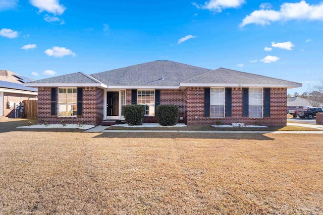 ranch-style home with a front lawn