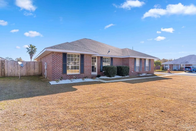 single story home with a front yard