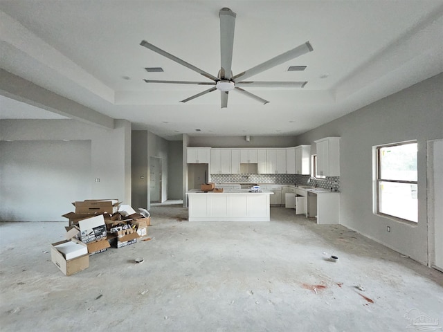 kitchen featuring white cabinets, decorative backsplash, and dishwasher