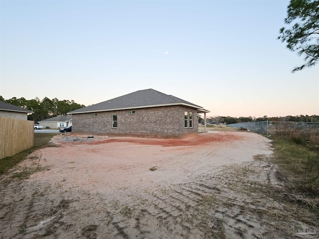 view of property exterior at dusk