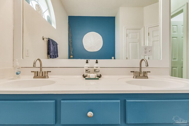 bathroom with vanity, toilet, and tile patterned flooring