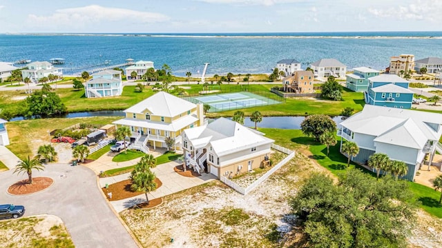 bird's eye view featuring a water view and a residential view