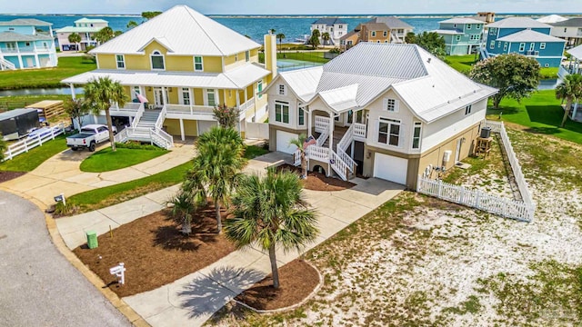 aerial view with a water view and a residential view