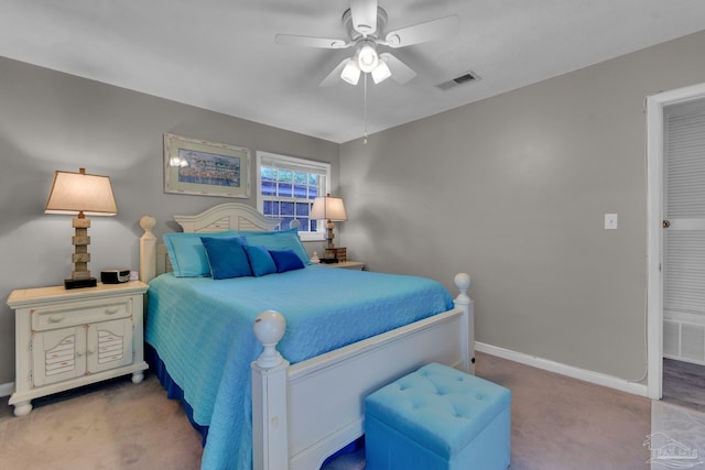 bedroom featuring ceiling fan and carpet