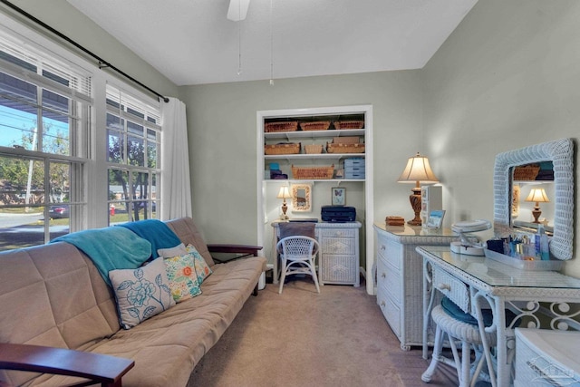 interior space featuring carpet flooring and ceiling fan