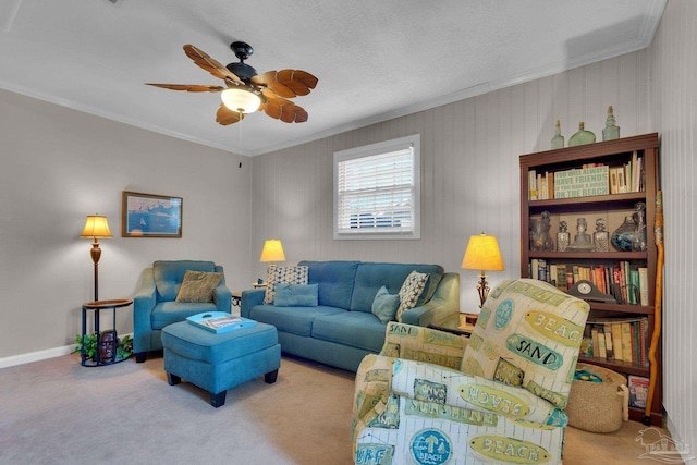 carpeted living room with ceiling fan and crown molding