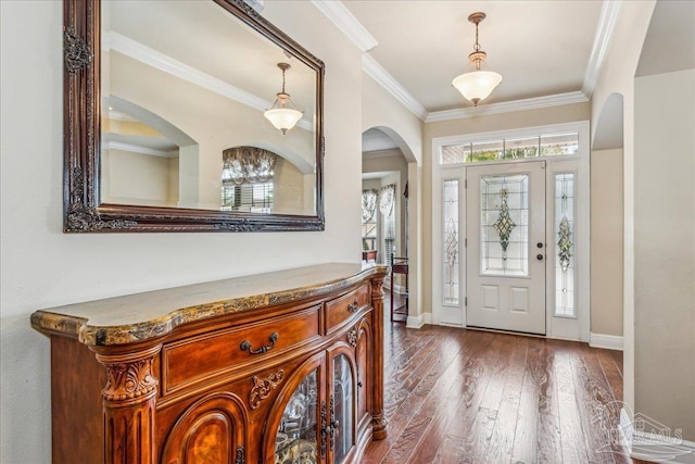 foyer featuring dark wood-type flooring and ornamental molding