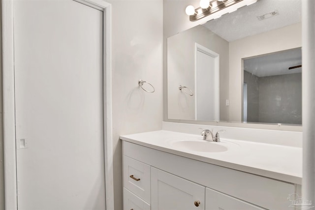 bathroom featuring visible vents and vanity