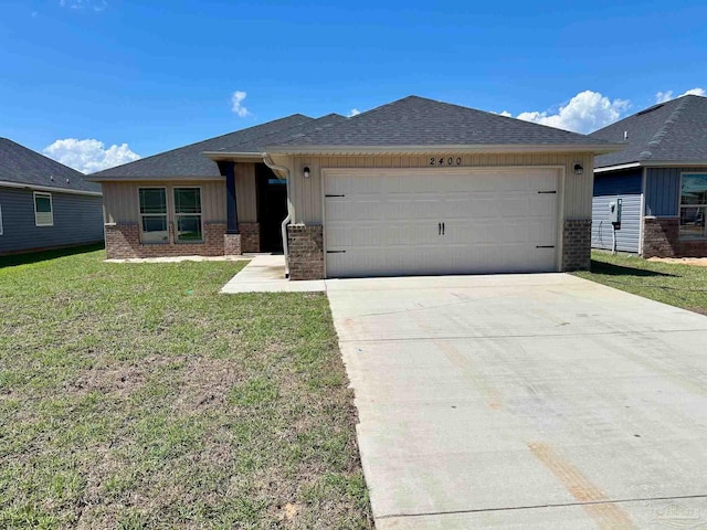 view of front facade featuring a garage and a front yard