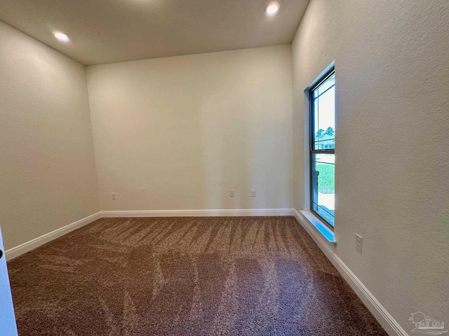 carpeted empty room with plenty of natural light