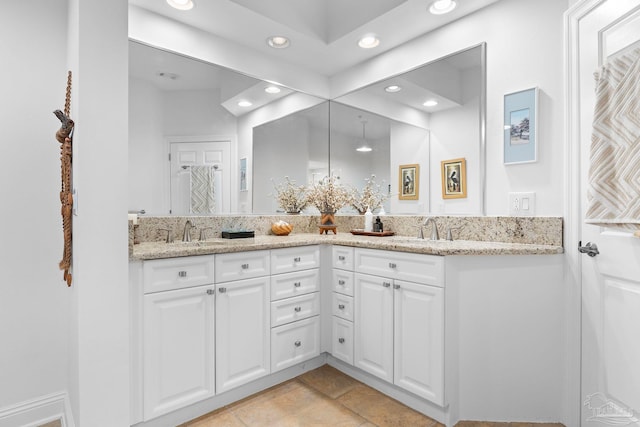 bathroom featuring double vanity and tile patterned floors