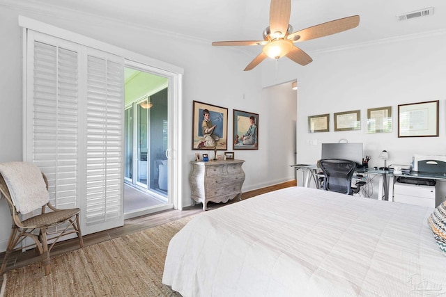 bedroom with ornamental molding, light hardwood / wood-style flooring, ceiling fan, and access to exterior