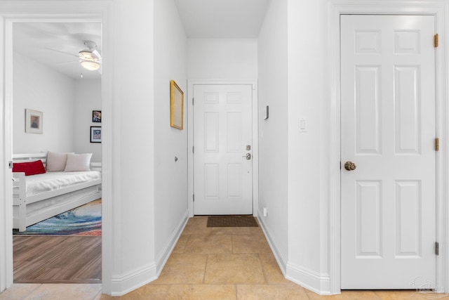 hallway featuring light tile patterned floors