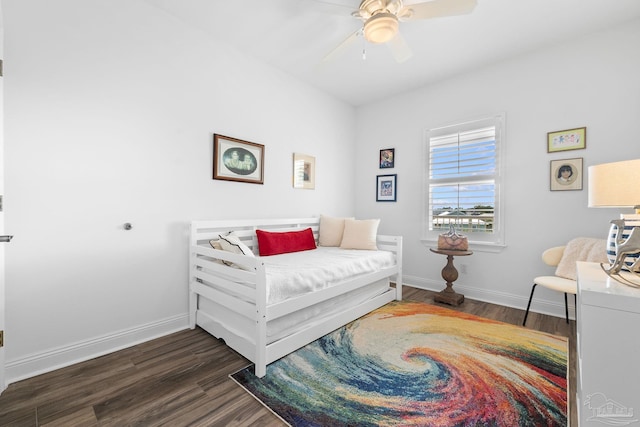 bedroom featuring dark hardwood / wood-style flooring and ceiling fan