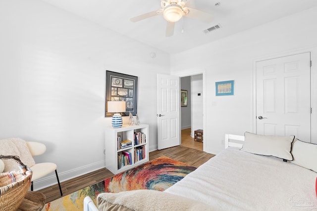 bedroom with wood-type flooring and ceiling fan